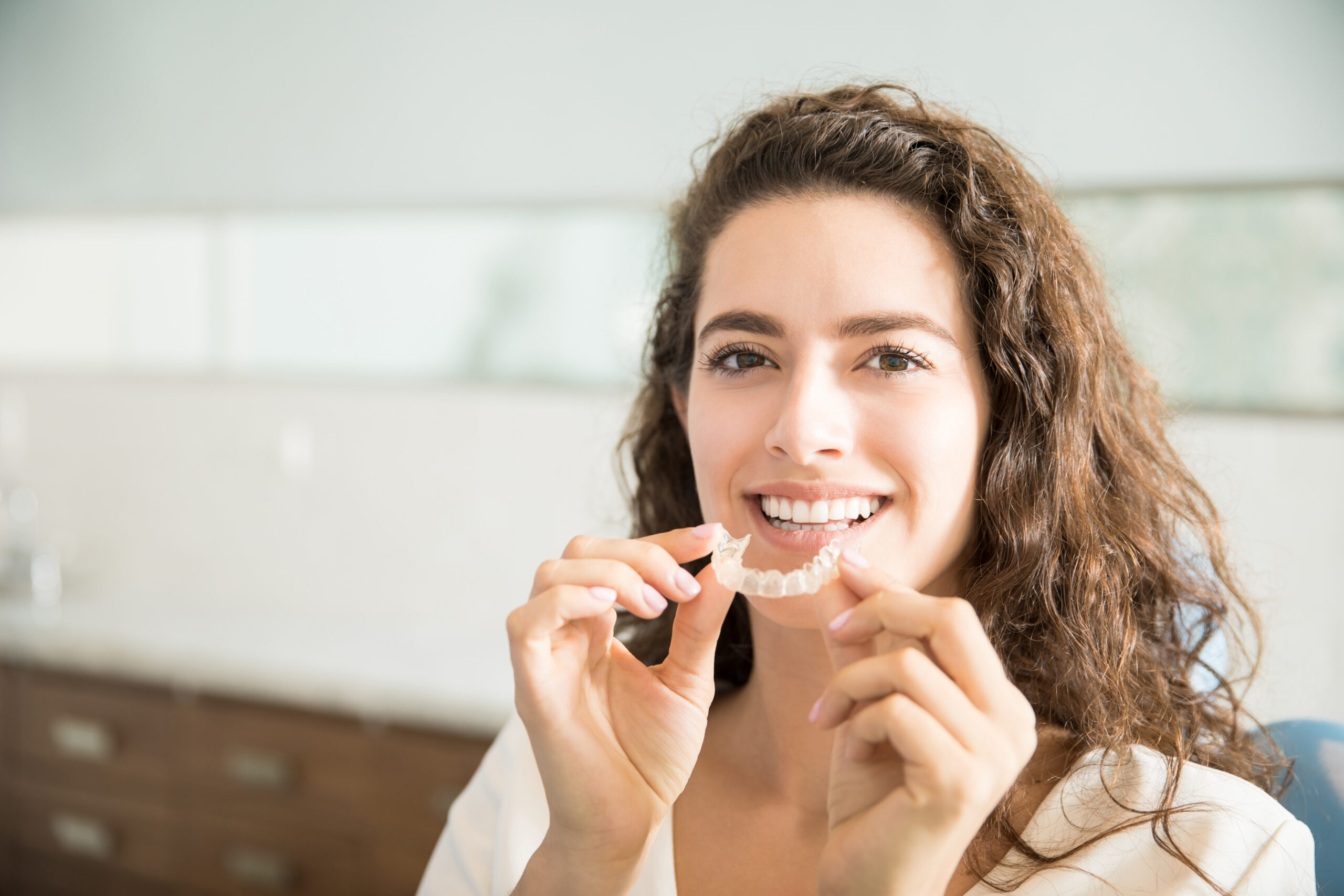 The Benefits of Invisalign or Clear Aligners for Your Teen and You at G Orthodontics