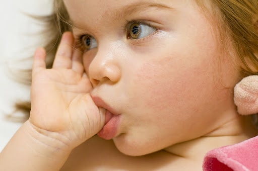 Early orthodontic checkup at age 7 in Houston for thumb sucking and proper jaw development